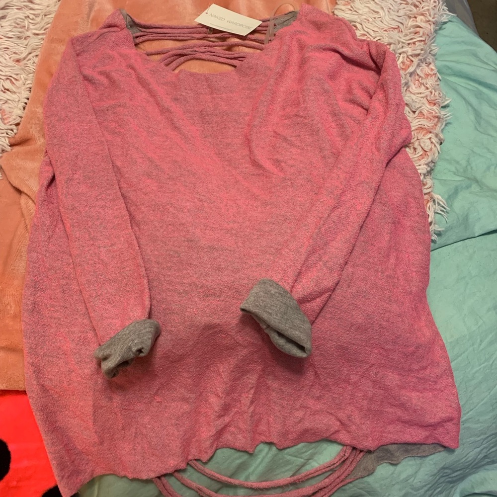 Woman’s shirt. Naked wardrobe. New.